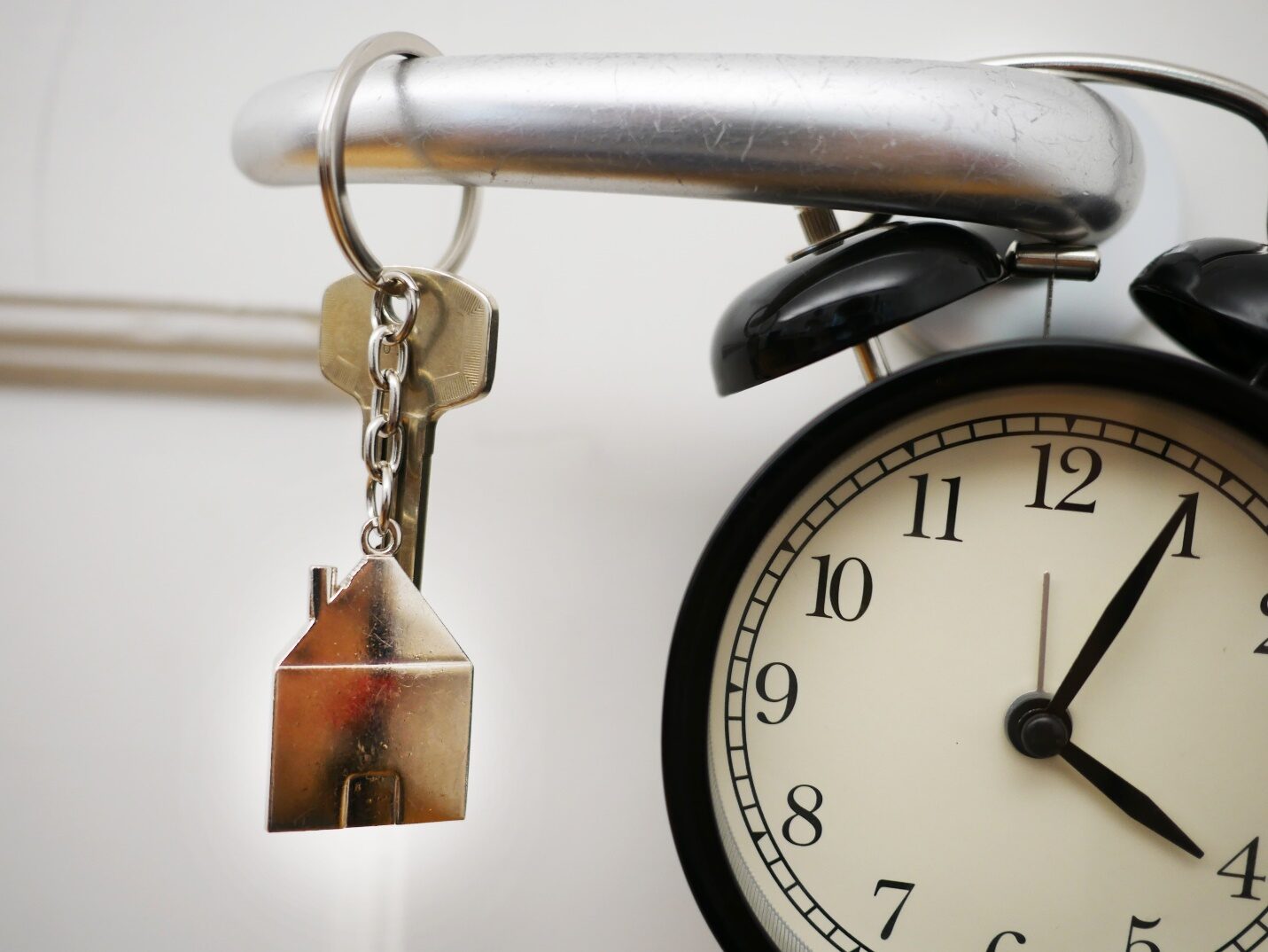 House Keys Hanging on a Door Knob Indicating Real Estate Services