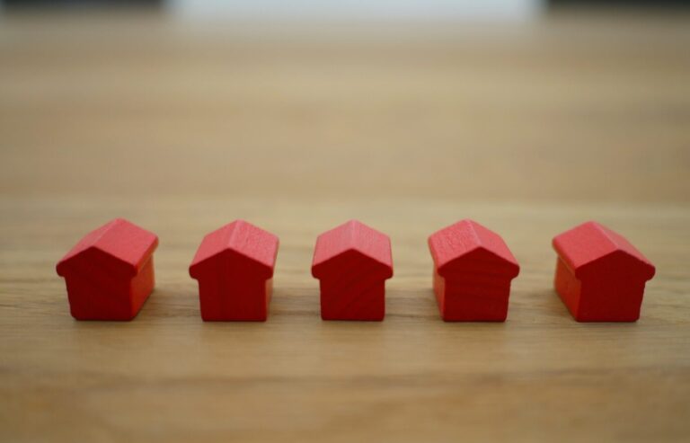 Wooden Mini Houses Indicating Property Listings