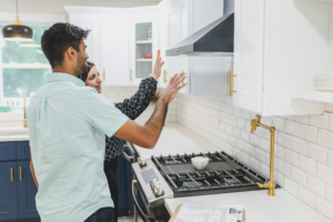 A man and woman in a kitchen