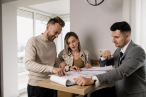 A couple reviewing a home listing with a real estate agent