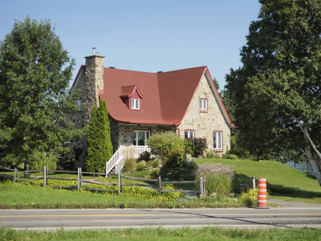 A brown house with a gabled roof