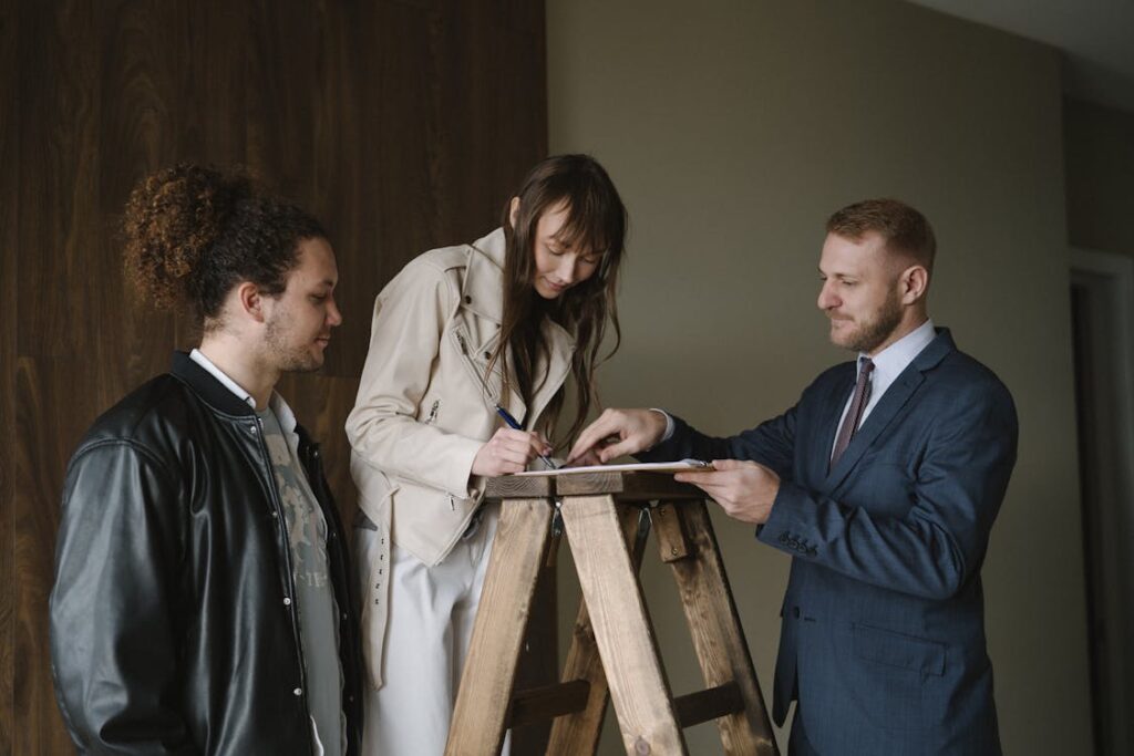 a woman signing a contract.