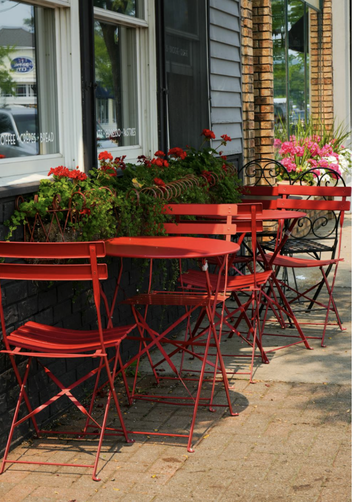 This photo shows a row of tables and chairs.
