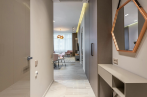 This photo shows a hallway leading to living spaces with clear, unobstructed paths.