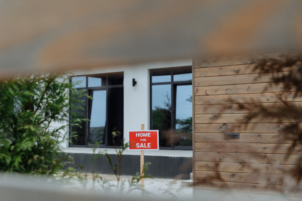 home for sale sign outside a property