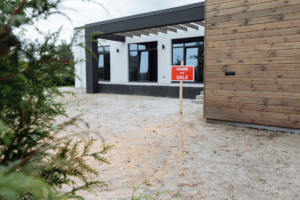 a home for sale sign outside a property