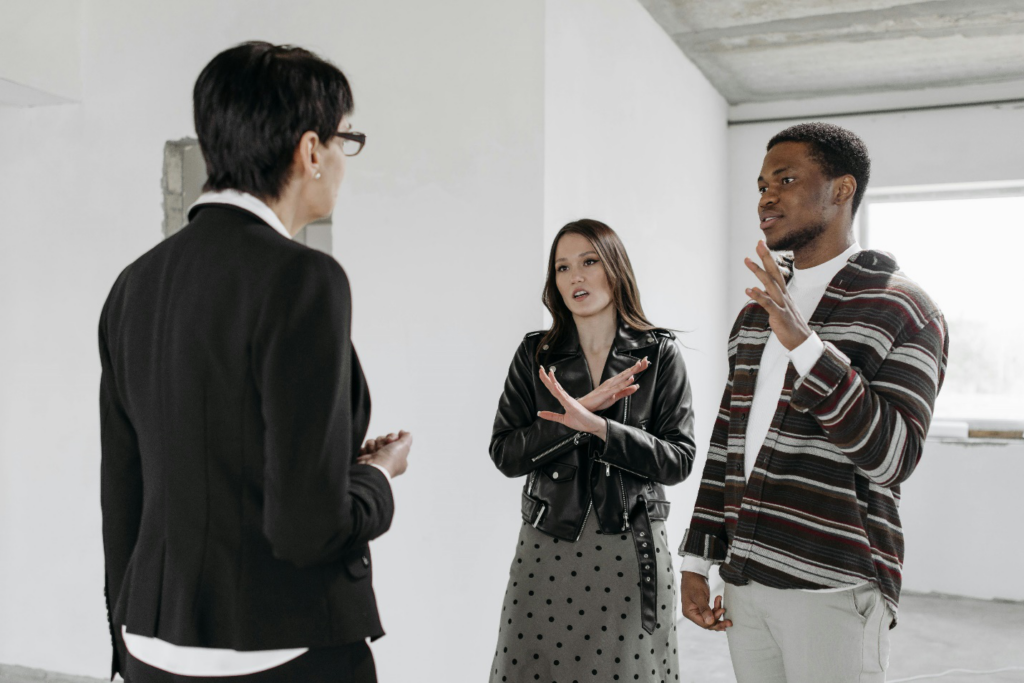 Real estate agent talking to clients