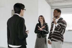 Real estate agent talking to clients