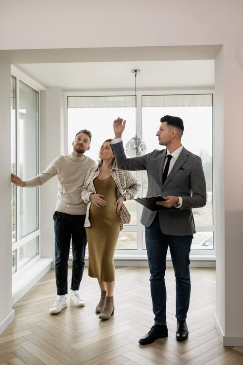 buyers touring a home