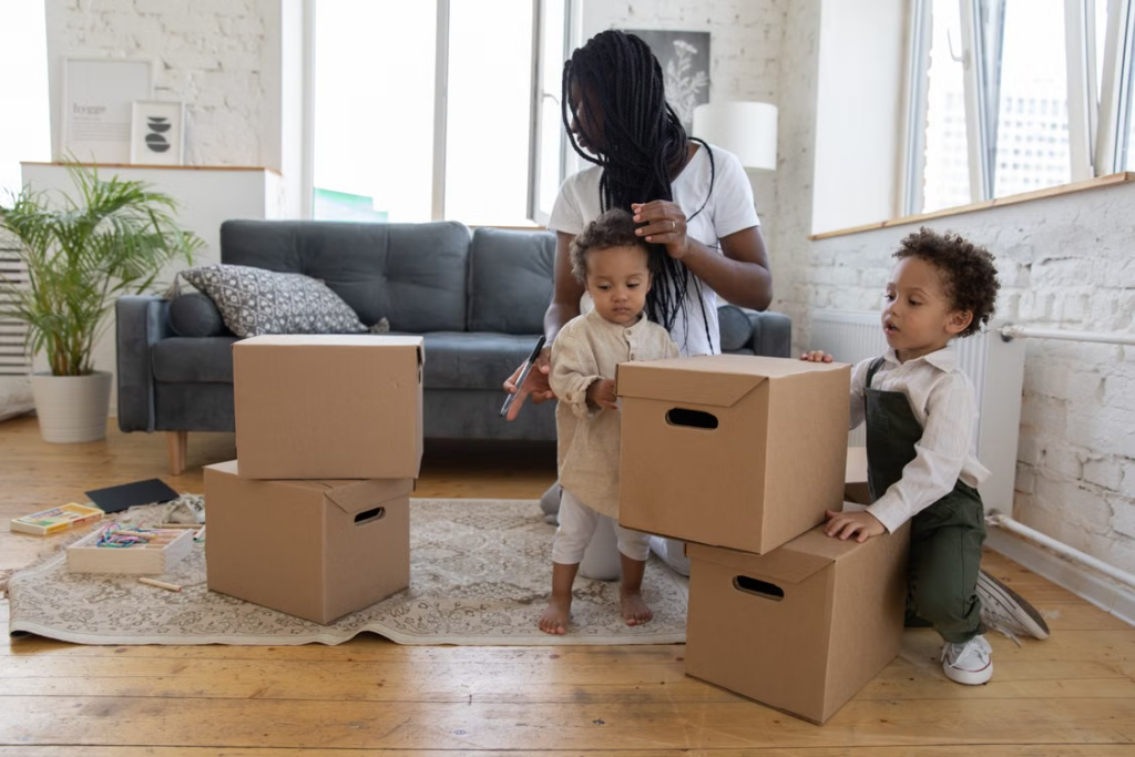 family packing household boxes